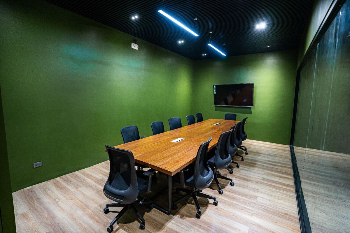 The large meeting room with its green walls