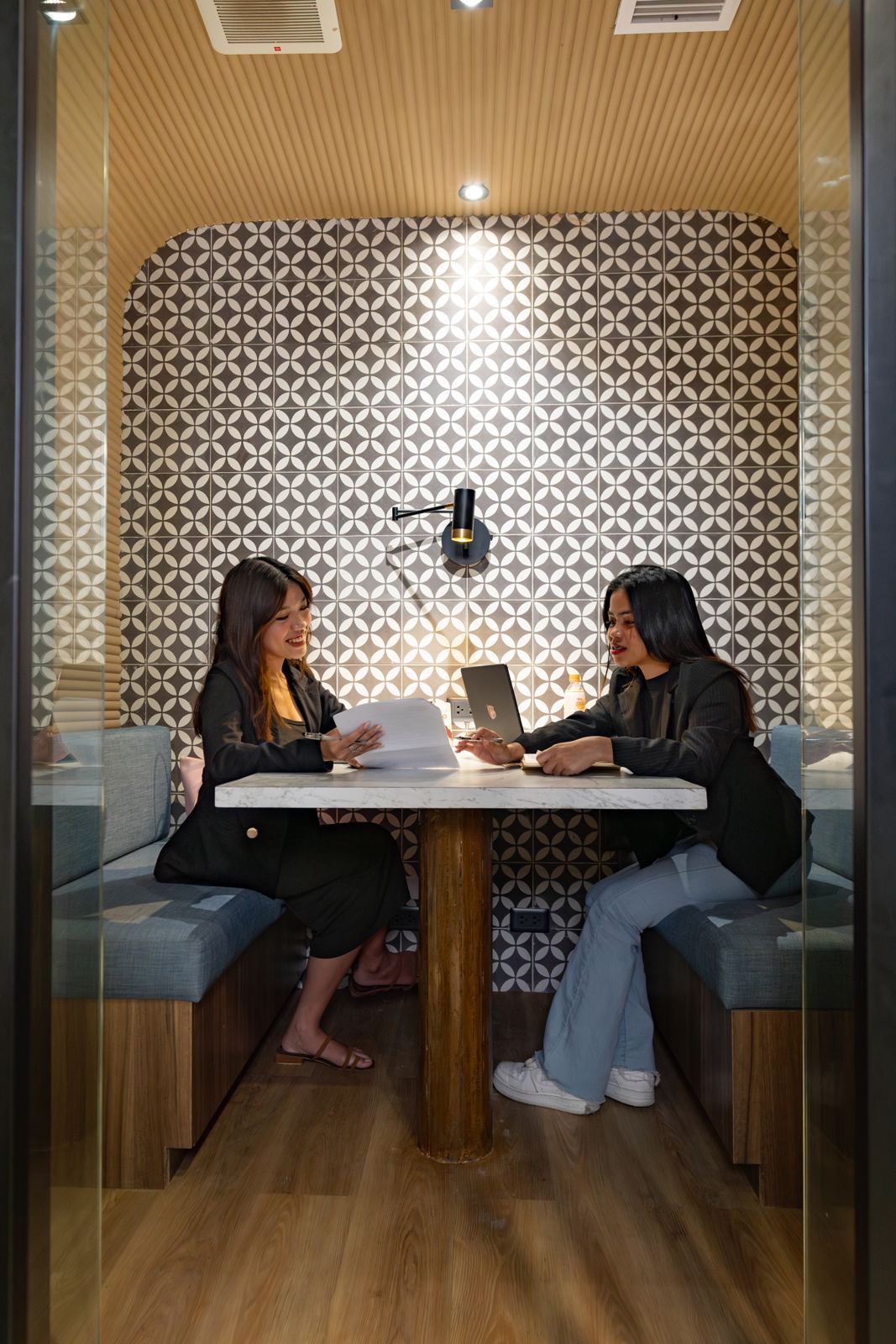 Two people meeting in a booth