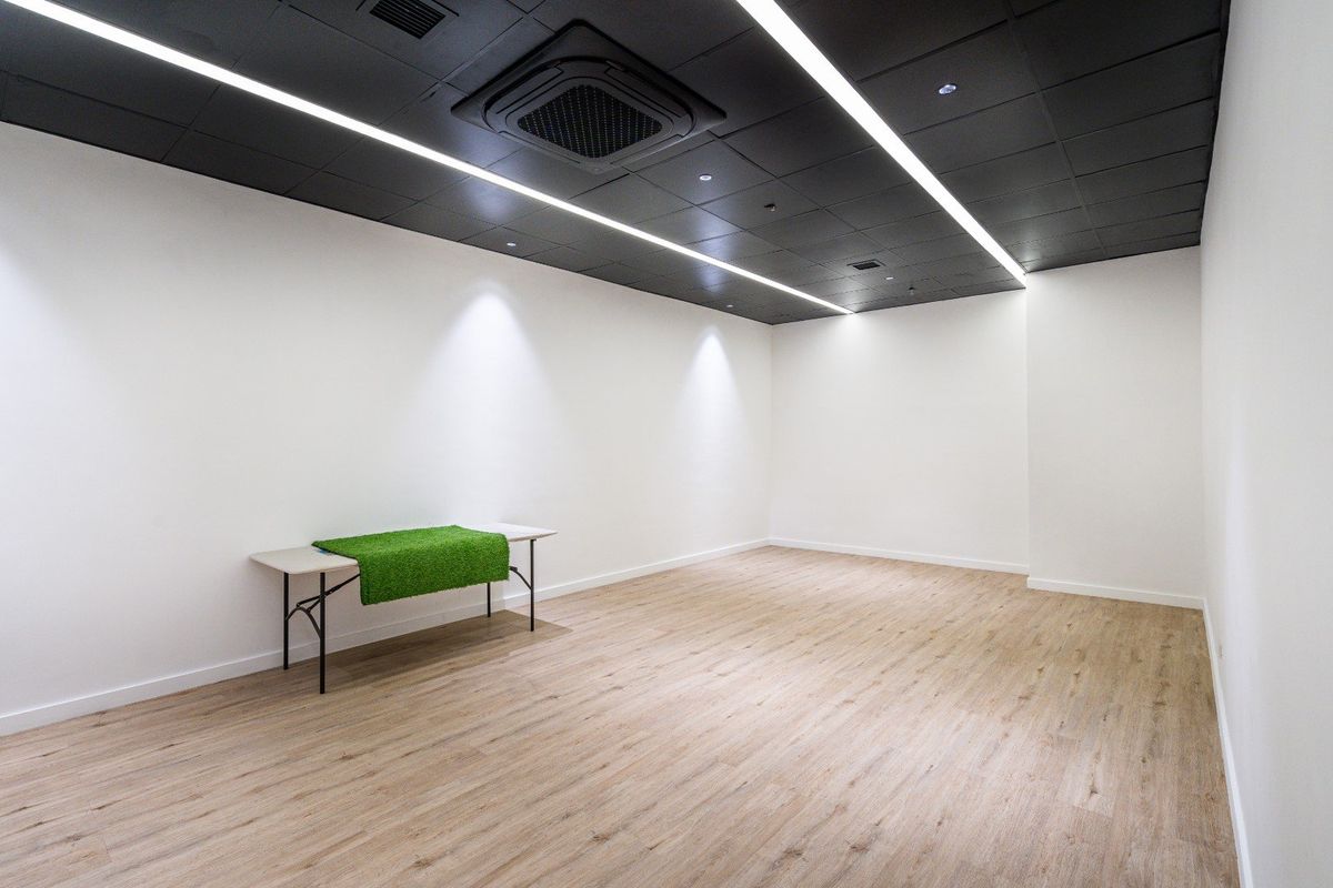 Studio 3, a multipurpose room with white walls and wooden floors